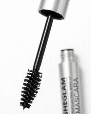 Close up of SHEGLAM Big Time Eyes olive shaped mascara brush wand with longer real life black stem and thick non-caking jet black formula - silver cap - shows unique brush that separates and lifts lashes