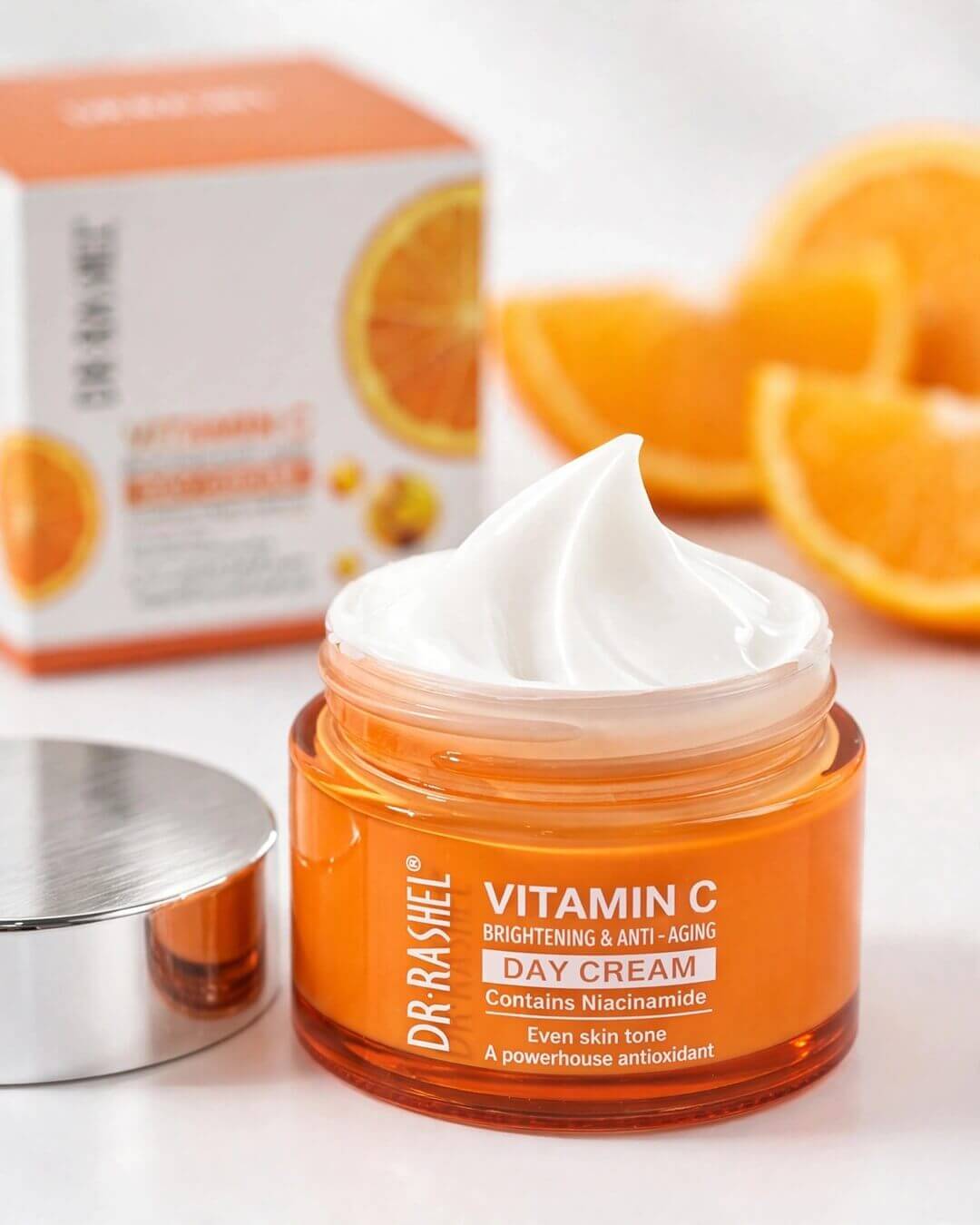 Open jar texture shot showing creamy whipped swirl of Dr. Rashel Vitamin C Brightening Day Cream with Niacinamide