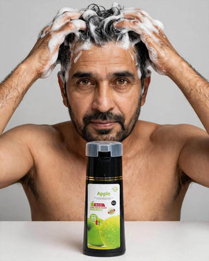 Pakistani man 48 using black beard hair dye shampoo Apple 200ml white lather foam shoulders only no shirt eye contact, 3 in 1 ammonia free grey coverage long hours Pakistan