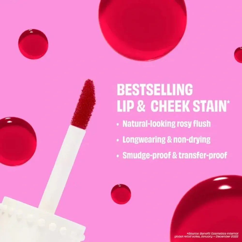 Lip and cheek stain with applicator on a pink background