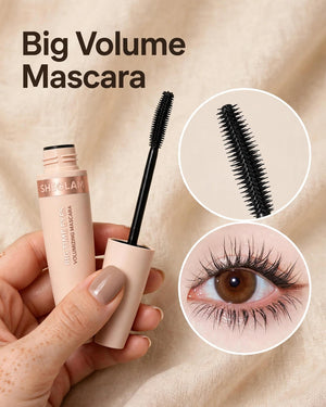 Hand holding SHEGLAM Big Time Eyes Volumizing Mascara with olive brush close-up and eye lash volume result inset